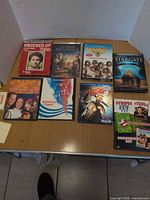 Eight DVD cases laid out on table