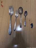 All four flatware pieces arranged side by side