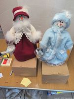 Both Avon Snow Ladies standing on their original boxes