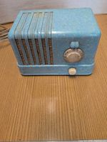 Front view of blue GE C400 radio