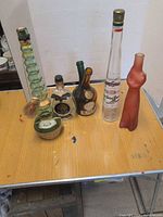 All seven bottles arranged on tabletop for overall view