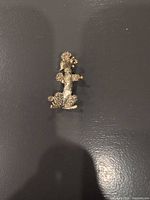 Front view of gold-tone poodle brooch