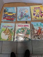 Six Little Golden Books laid out showing all covers