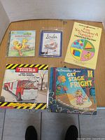 All five children’s books laid out together