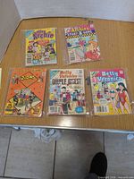 Group shot of five Archie digest comics in sleeves