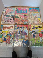 All six bagged Archie comics laid out