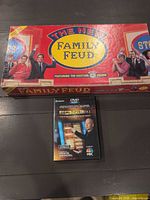 Family Feud game box and Deal or No Deal DVD game case together