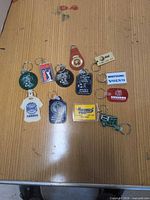 All 12 keychains spread on table for overview