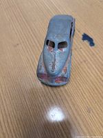 Front top view showing streamlined hood, grille detail and paint wear