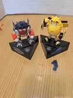 Both M&M Transformers coin banks on bases