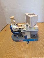 Full view of Dilbert electronic candy dispenser showing figure, desk and monitor
