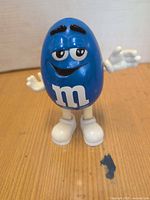 Front view of Blue M&M dispenser