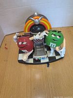 Front view showing jukebox design and both M&M characters