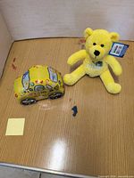 Overall view showing car tin and plush bear