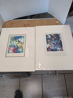 Both matted monoprints side by side