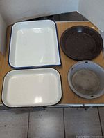 Group shot of four enamel pieces arranged together