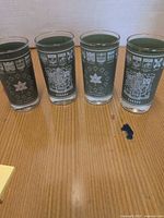 Front view, four glasses standing side by side