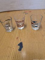 Three novelty shot glasses front view