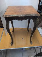 full view of wooden side table on platform