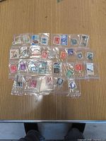 All 30 stamps laid out in sleeves