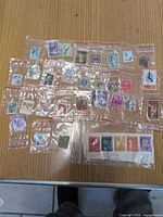 All 30 stamps in individual sleeves on tabletop