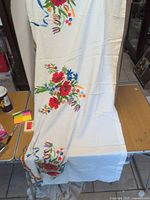 Full view of runner draped to show overall size and white fabric