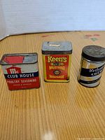 Front view of all three tins