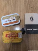 Front view of St Bruno tin, Erinmore tin, Buxton box