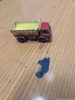 Overall view of truck showing cab and dump bed