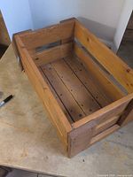 top angled view showing interior slatted base and overall construction