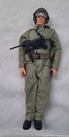 Full view of action figure in uniform with accessories