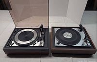 Dual 1218 and PE 2035 turntables side by side with dust cover on Dual