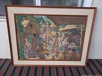 Full view of framed painting showing artwork, frame and mat