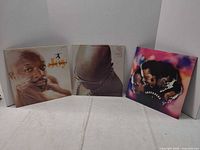 All three album jackets upright for overview