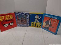 Group shot of all four vinyl LP album covers