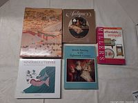 Front view of all five books showing covers
