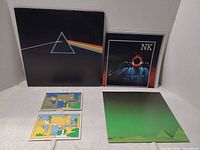 Front cover, postcard inserts, poster