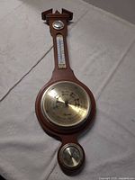 Full view of wood weather station showing all three instruments