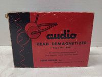 Front of original red/black box showing branding and model information