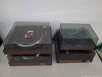 Four turntables in two stacks with dust covers