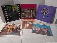 Front covers of all six LPs standing upright