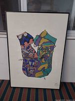 Full view of framed artwork showing entire composition, frame, and glazing