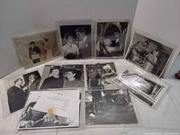 Overview of all sleeved photographs laid out on table