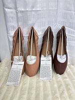 Front view of both pairs with tags and stuffing visible