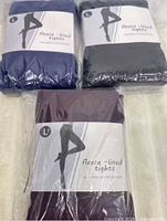 Three packages of fleece-lined tights in blue, black, burgundy