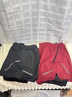 Both pairs of shorts laid flat showing colors and style