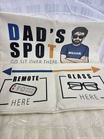 Full view of one pillow cover showing design text, pockets and cartoon graphic