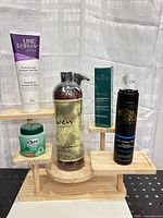 Full group shot of all five personal-care products on display stand