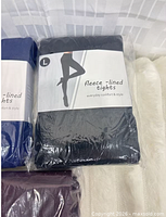 Front view of navy blue tights package
