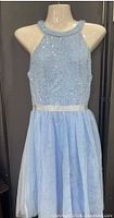 Front view of baby blue sequin bodice and tulle skirt dress on mannequin